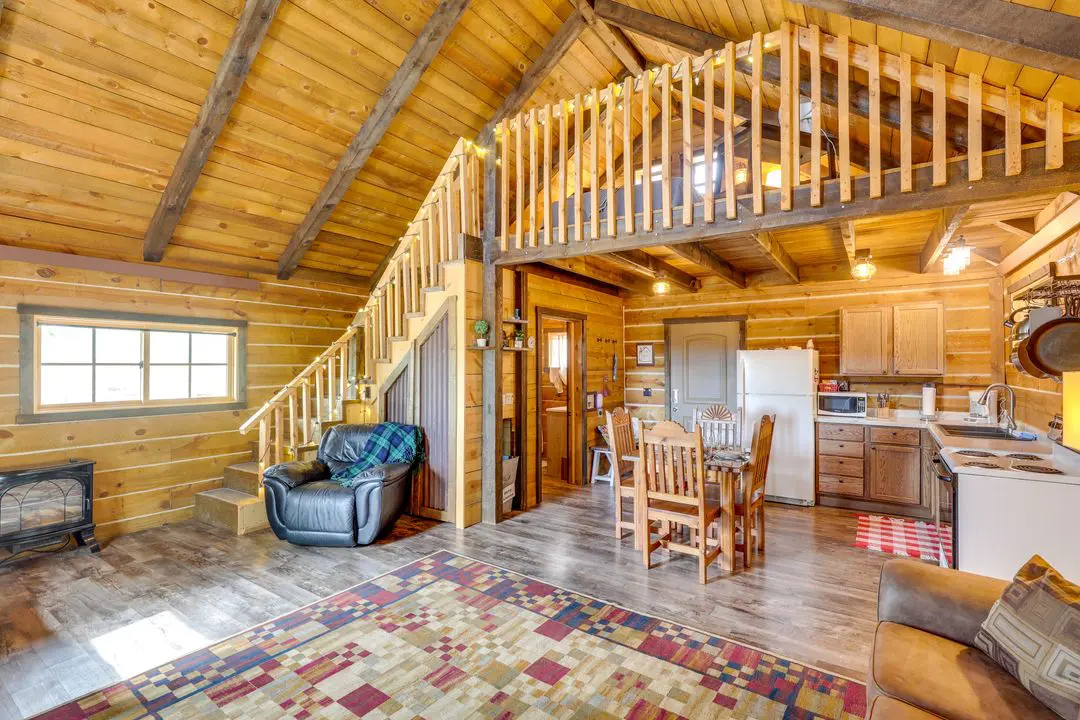 A living room with a couch and chairs in it
